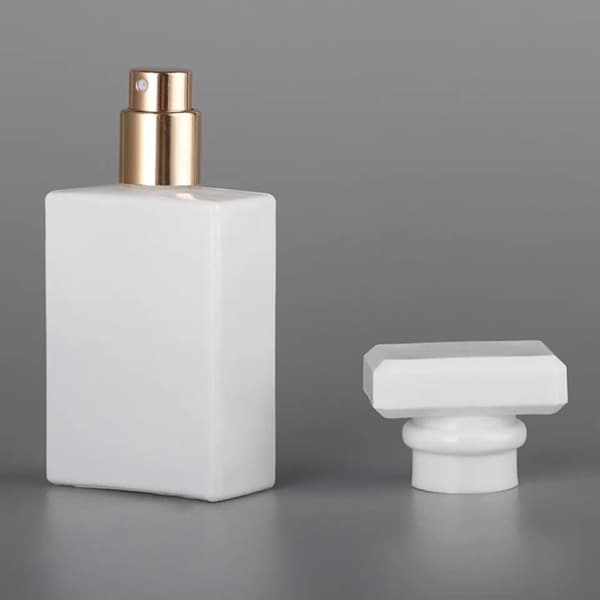 white perfume bottle with cap