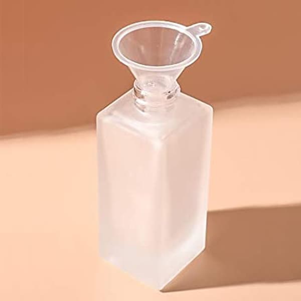 empty lotion bottle with funnel