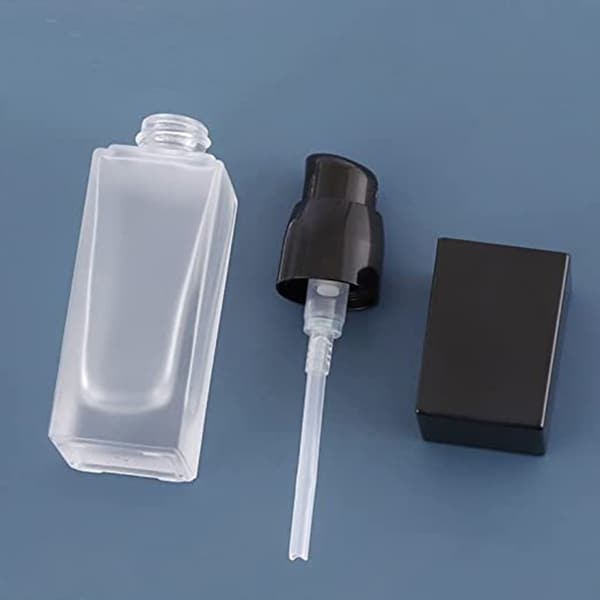 small lotion bottle with black pump