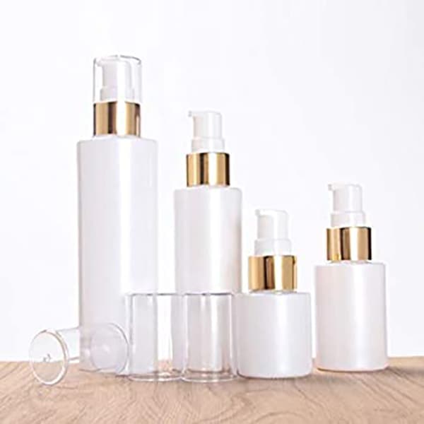 white lotion bottles in different sizes