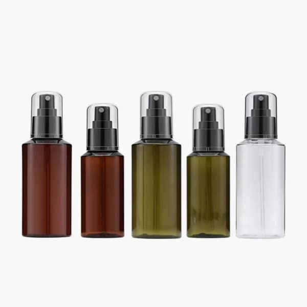 different colors of lotion spray bottles