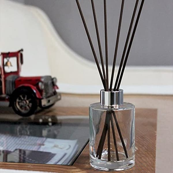 diffuser bottle with metal cap in living room