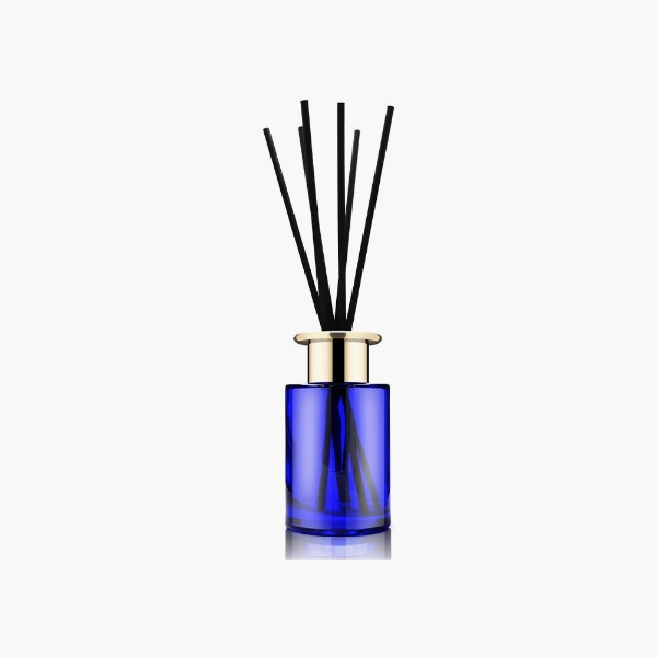 blue diffuser bottle with sticks