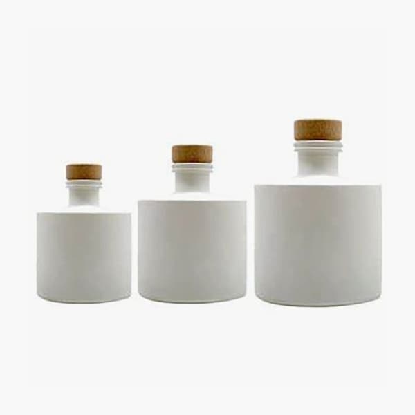 white diffuser bottles of different sizes