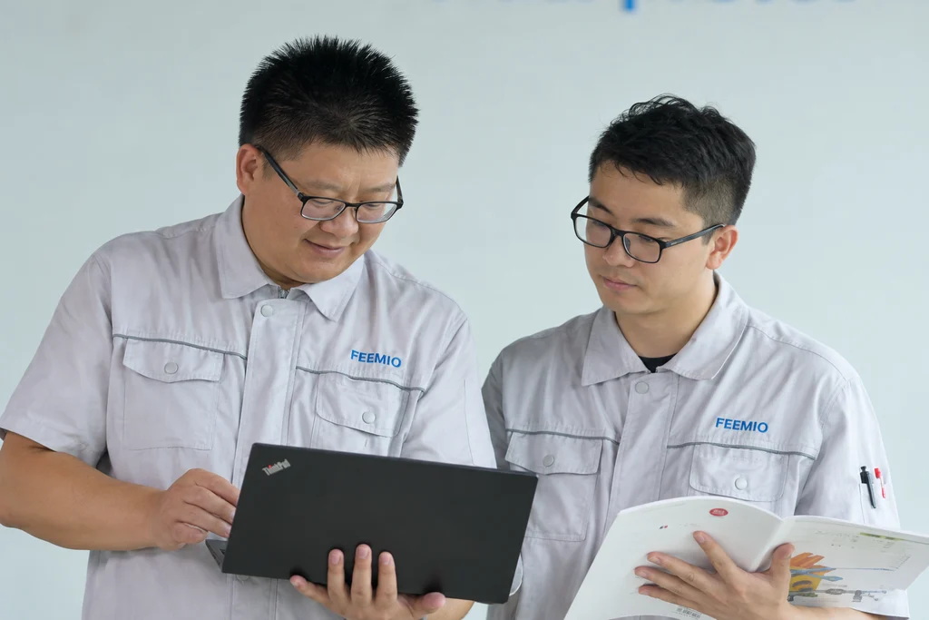 Team members reviewing project materials and product information; adapted from supplied service photography