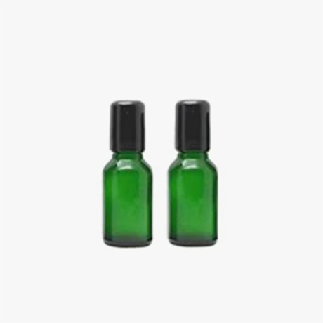 green perfume oil bottles