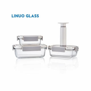 three vacuum glass food containers with beige lids and pump