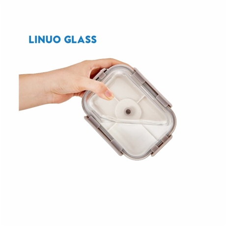 hand holding a four-lock vacuum lid with center valve